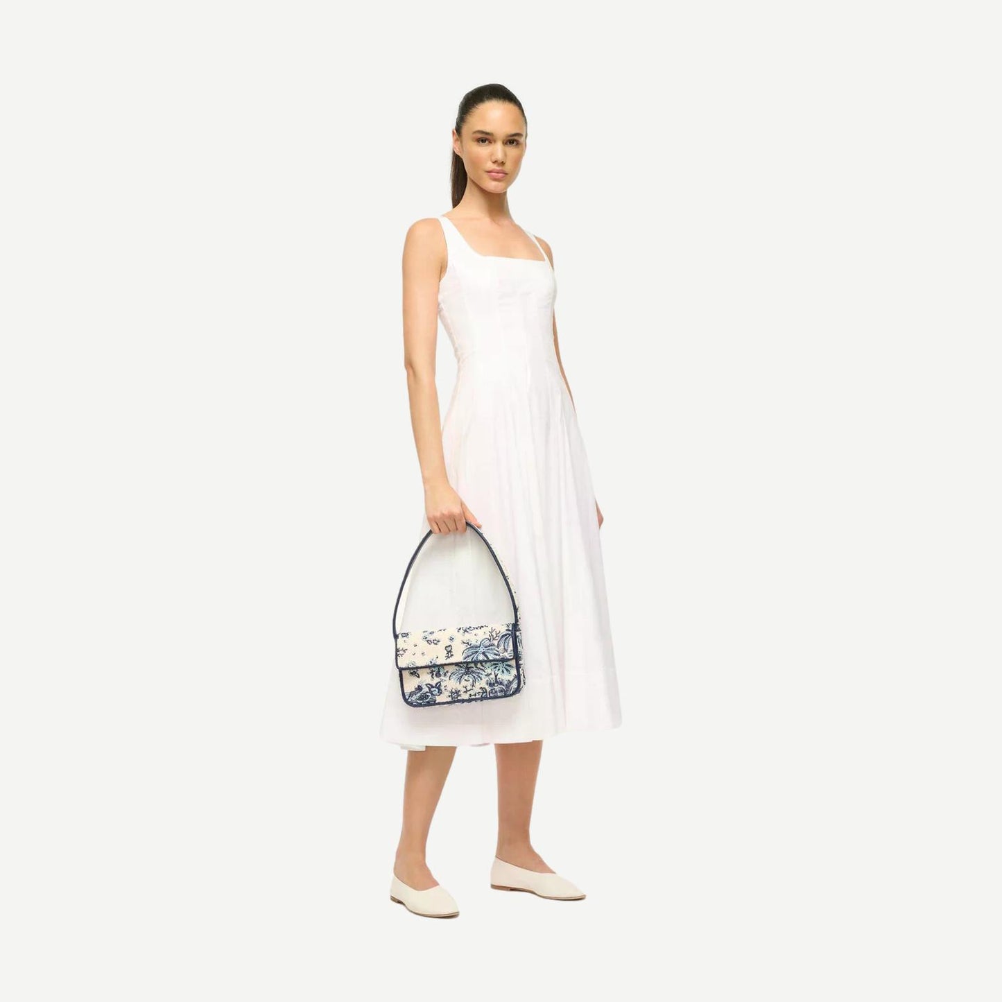 Staud Tommy Beaded Bag in Toile De Pup with intricate beadwork and structured purse design, featuring a top handle and clasp closure.