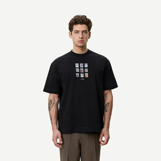 Les Deux Stamp T-Shirt in black, featuring a classic crew neck and branded stamp graphic