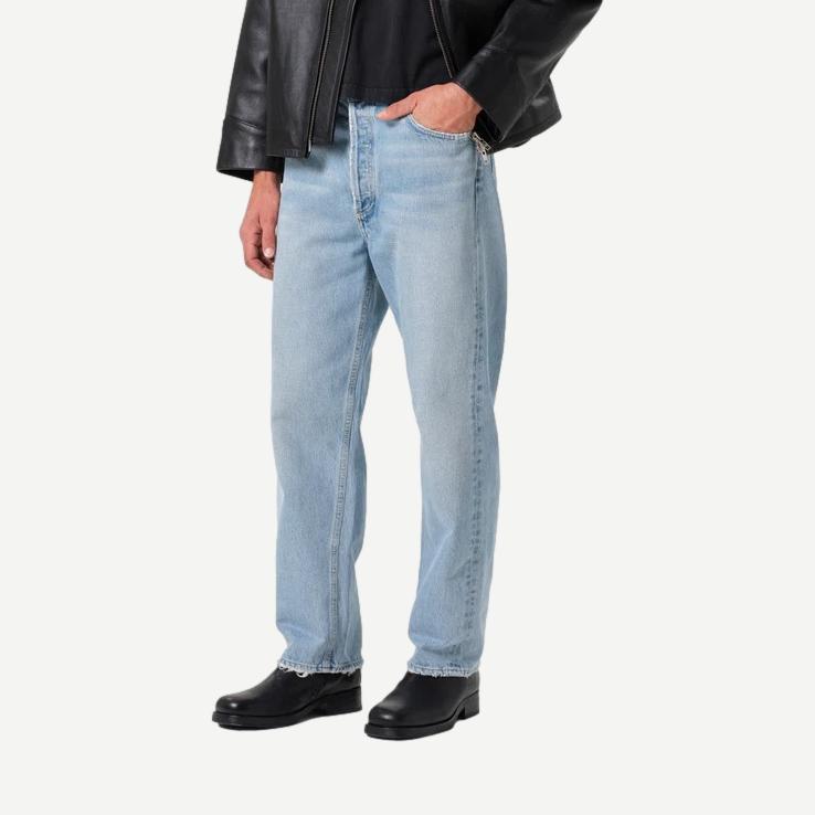 Light wash 90's Jean Force denim jeans by Agolde displayed on a model, showcasing high-waisted fit and classic vintage style.