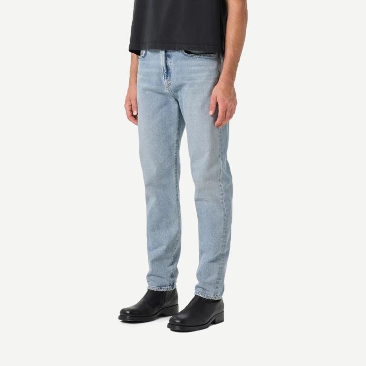 Agolde Curtis Jean Turmoil in denim, showcasing a stylish fit with distressed details and classic five-pocket design.