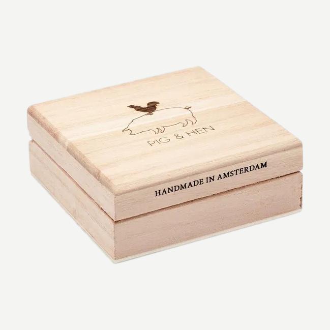 Black Tiger Eye bracelet by Pig & Hen featuring 6mm beads in a sleek, polished design shown in a box.