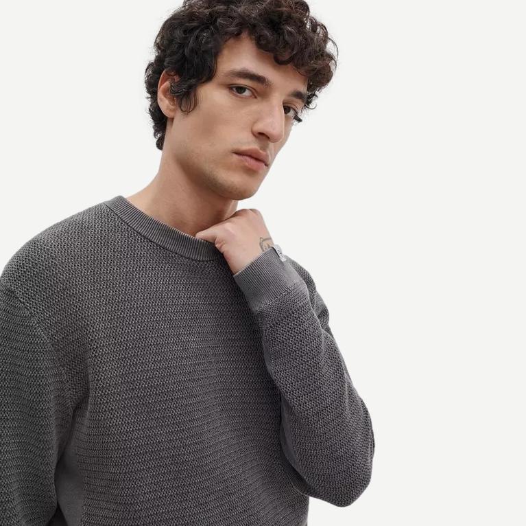 Rag and Bone Caden Washed Crew sweater in charcoal green, showing a close-up of the crewneck knit fabric and subtle washed texture.