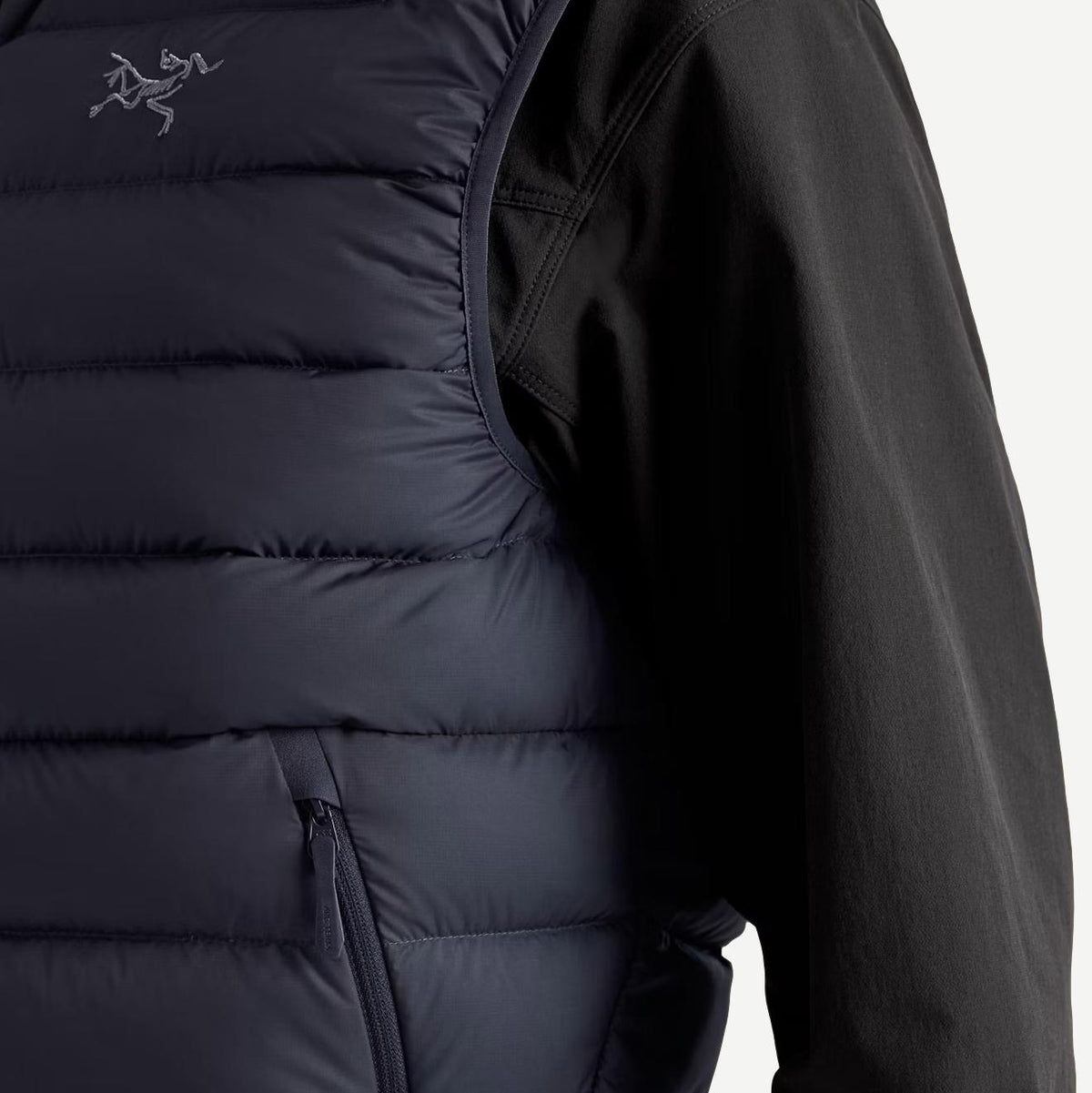 Arcteryx Cerium Vest for men in black sapphire, showing fabric detail and sleek design for outdoor layering.