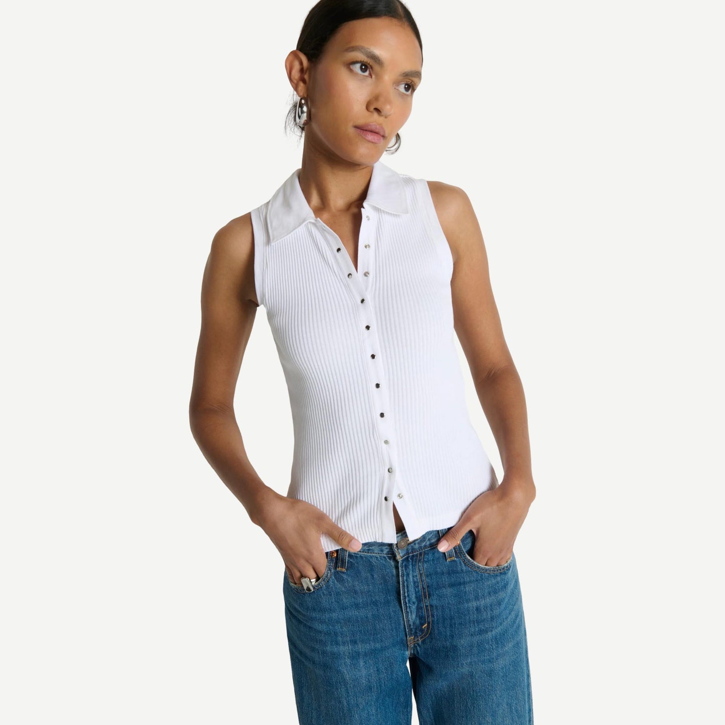 White Jaylin Polo Top by Nation LTD, featuring a classic collar and short sleeves, laid flat on a neutral background.