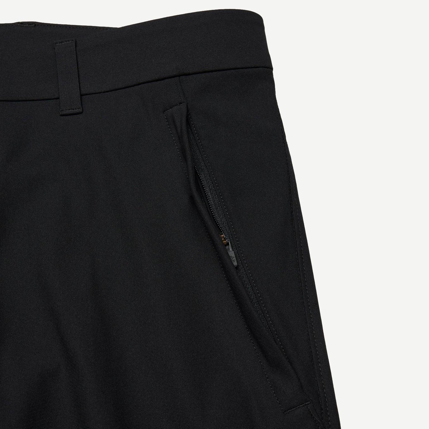 Black Stretch Warp Knit Coach's Slim Pant by Reigning Champ, showing the sleek, fitted design and smooth fabric details.