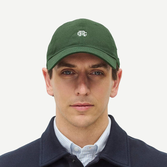 Reigning Champ New Era 9Twenty mini monogram cap in British Racing Green, stylish men's hat with adjustable fit.