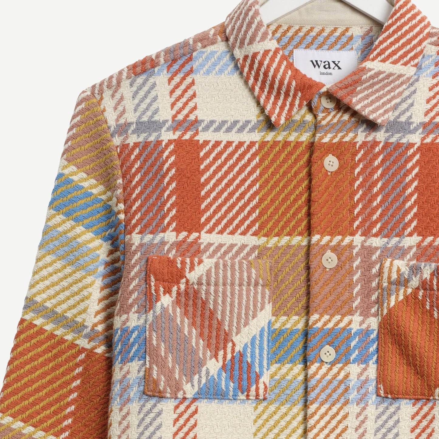 Wax London Whiting overshirt featuring a pastel multi Bude check pattern and button detail.
