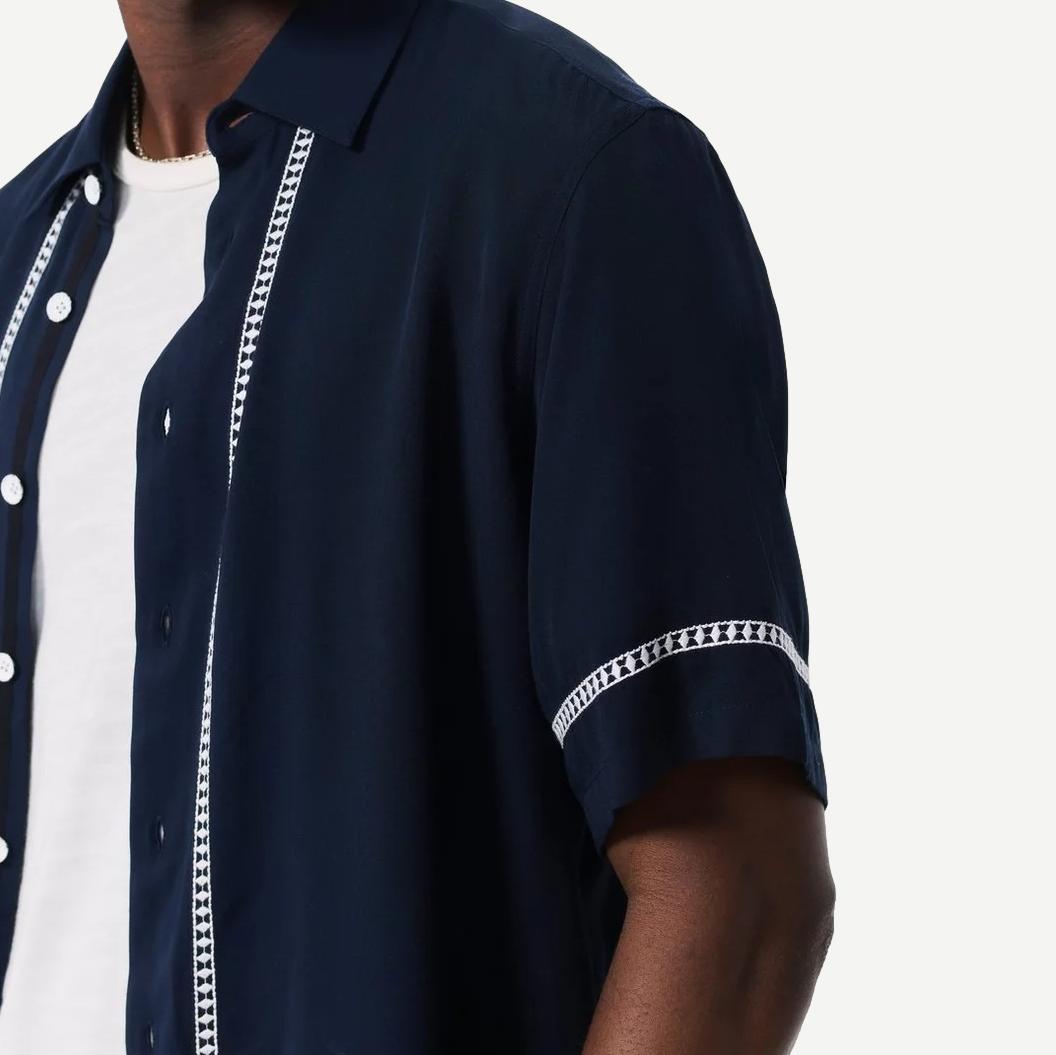 Blue Ezra Stripe Dalton embroidered shirt by Rag and Bone, showing the classic striped pattern and embroidered details on the fabric.