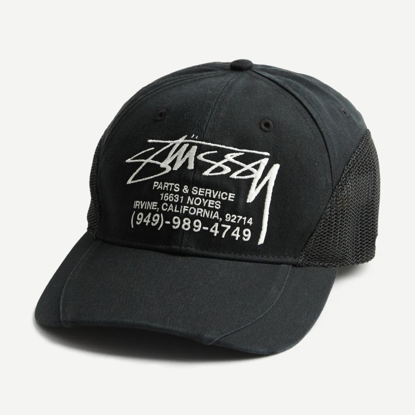 Black Stussy LP Service Mesh Strapback Cap with adjustable strap and mesh back for breathability.