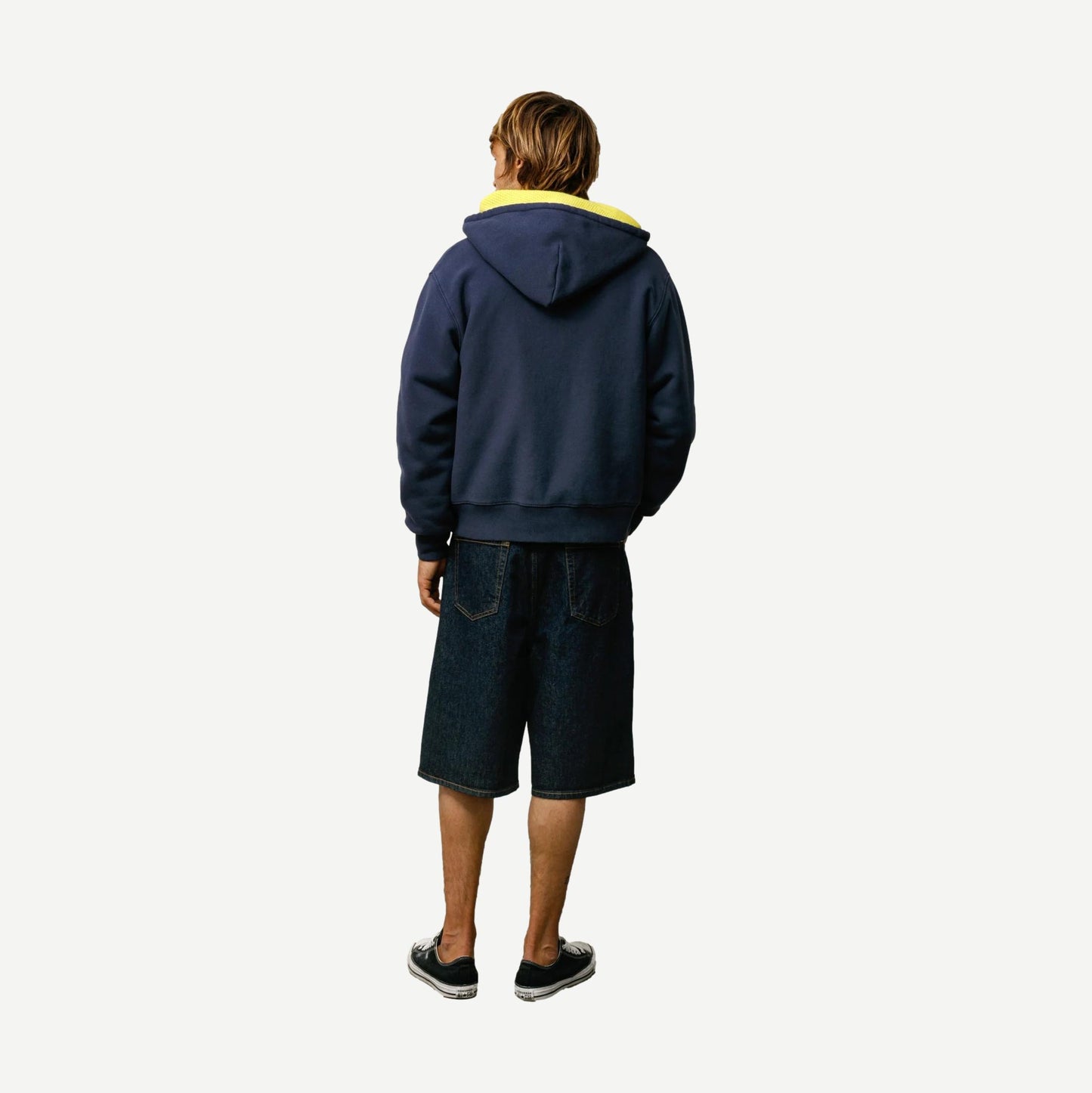 Stussy navy baggy beach shorts with relaxed fit and drawstring waist, perfect for casual summer wear.