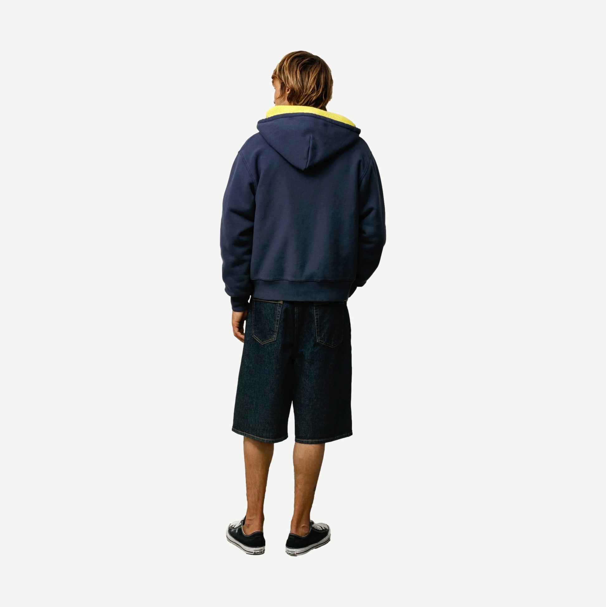 Stussy navy baggy beach shorts with relaxed fit and drawstring waist, perfect for casual summer wear.