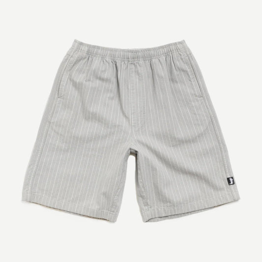 Stussy Baggy Beach Shorts in grey, loose fit with elastic waistband, casual summer shorts displayed on a model.