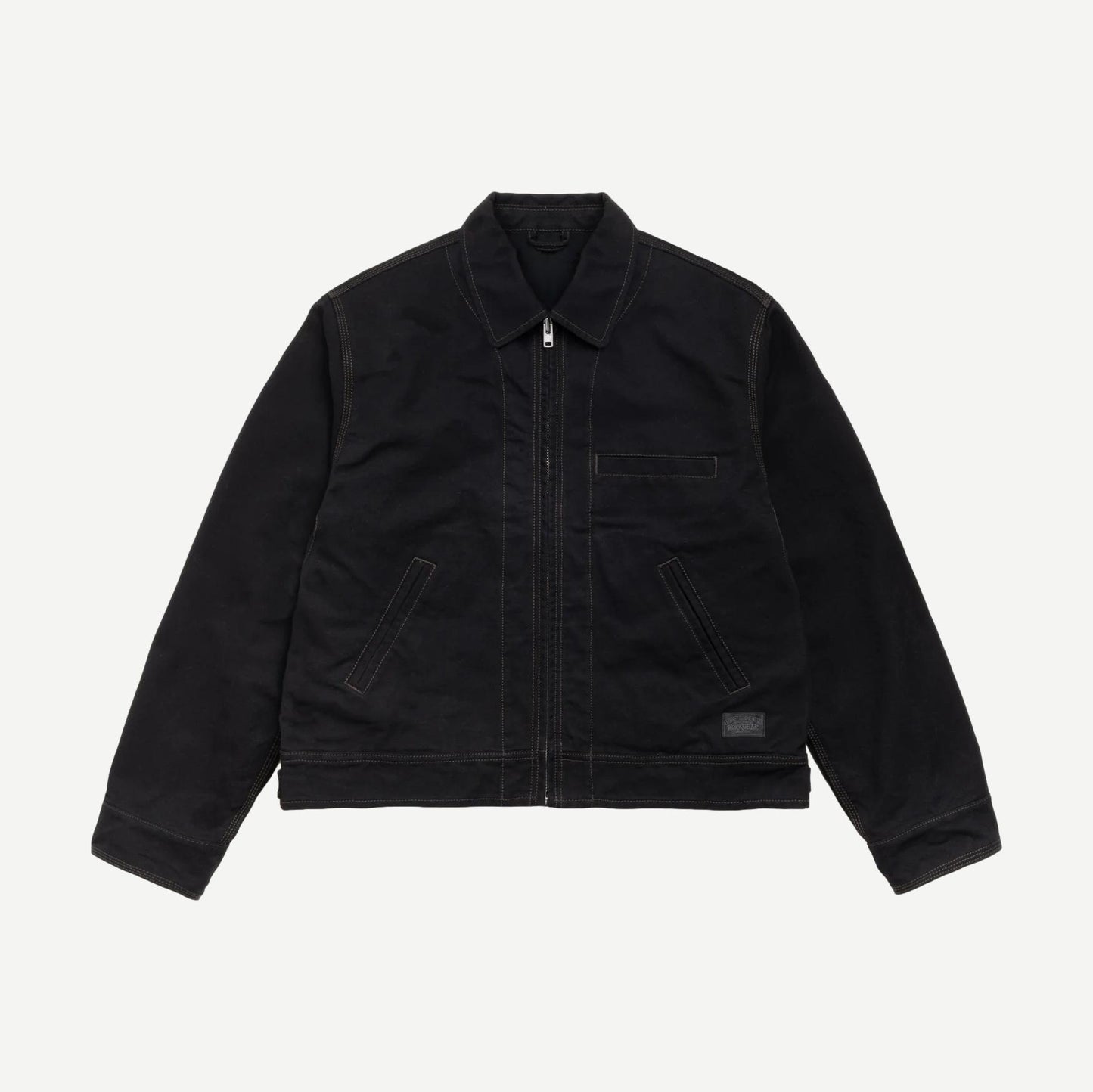 Black Stussy work jacket with a collared design, featuring durable fabric and practical style, ideal for casual or workwear.