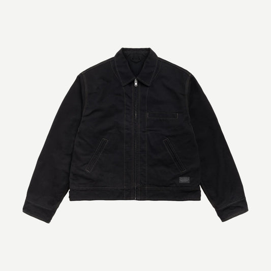 Black Stussy work jacket with a collared design, featuring durable fabric and practical style, ideal for casual or workwear.