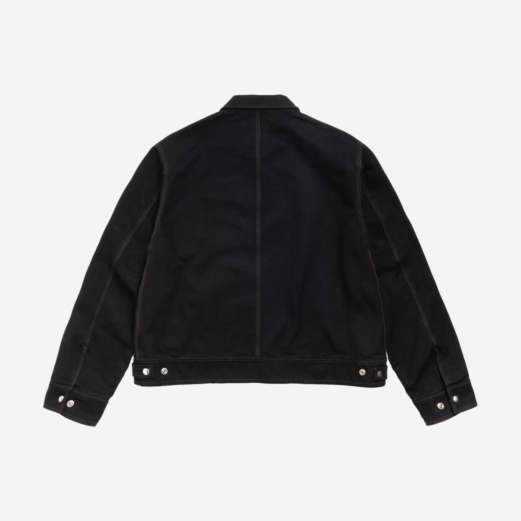 Black Stussy work jacket with a collared design, featuring a durable fabric and classic style for versatile casual wear.