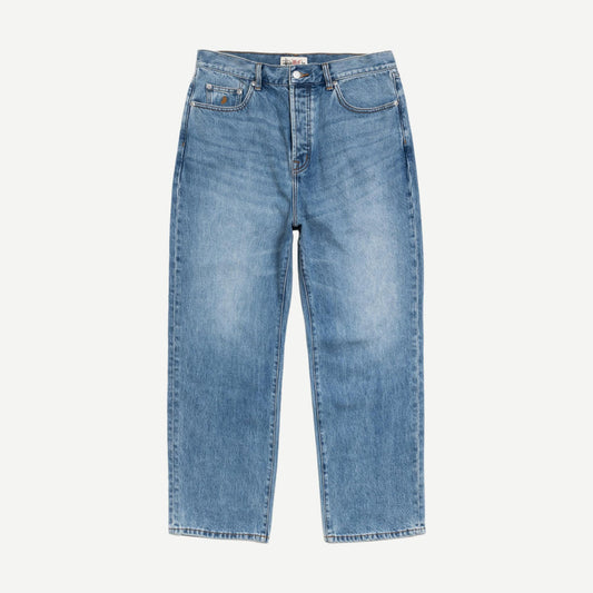 Stussy Big Ol Jean Denim in Indigo Stone Wash showing classic fit, distressed details, and stone-washed blue denim fabric.