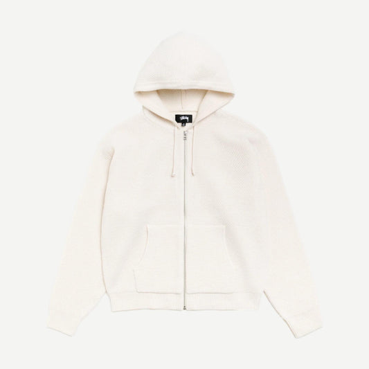 Stussy textured zip hooded sweater in bone color, featuring a hood, front zipper, and cozy fabric, casual streetwear style.