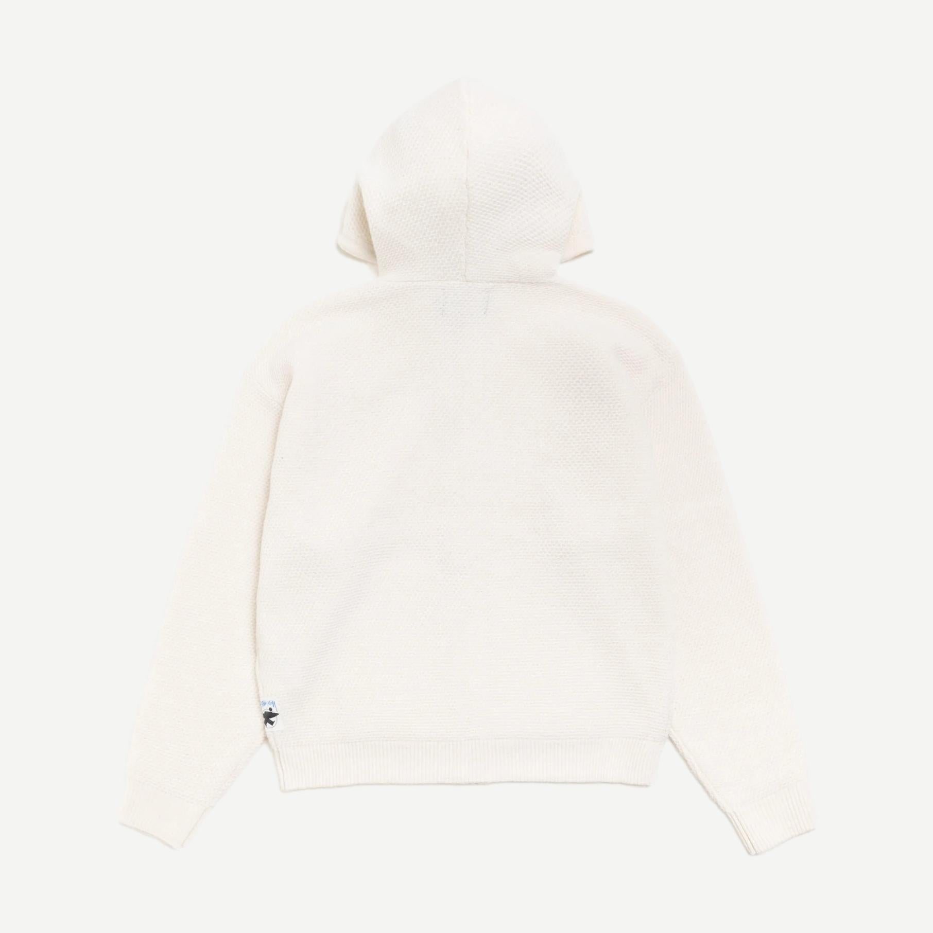 Stussy textured zip hooded sweater in bone color, featuring a hood, front zipper, and cozy knit design.