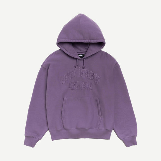Purple Stussy sweatshirt featuring a gear applique hood, with a close-up view of the detailed gear design on the hood.