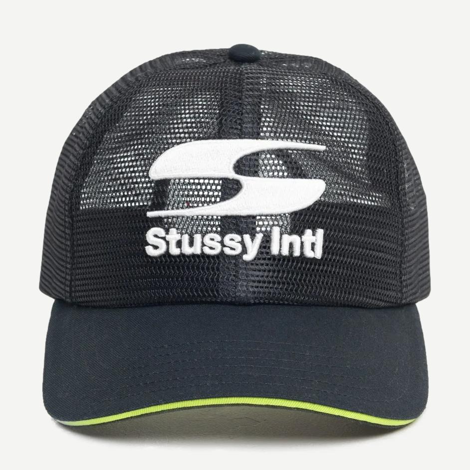 Stussy MD Moto S Trucker hat in black, featuring a classic trucker cap design with mesh panels and adjustable strap.