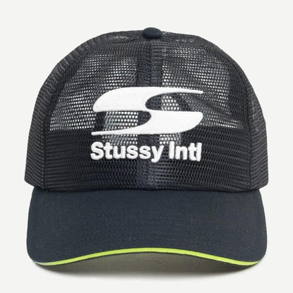 Stussy MD Moto S Trucker hat in black, featuring a classic trucker cap design with mesh panels and adjustable strap.