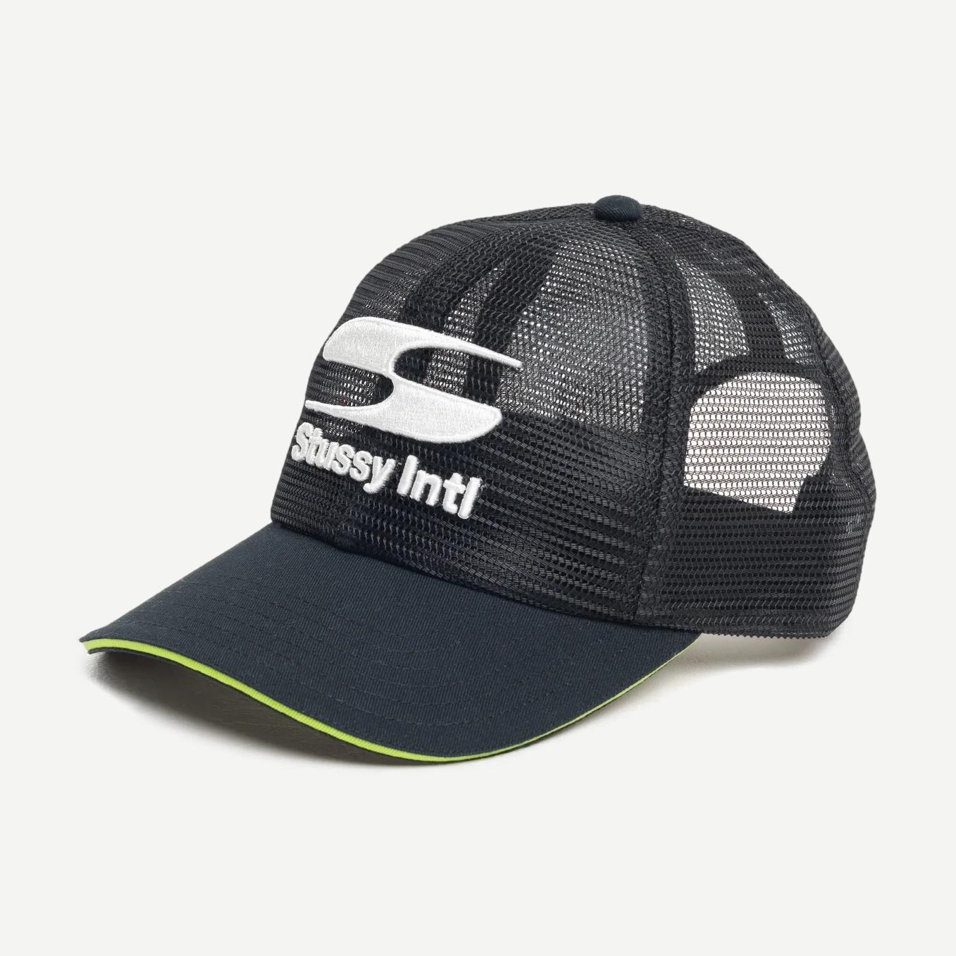 Stussy MD Moto S Trucker hat in black, featuring a classic trucker cap design with mesh back and adjustable strap.