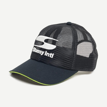 Stussy MD Moto S Trucker hat in black, featuring a classic trucker cap design with mesh back and adjustable strap.