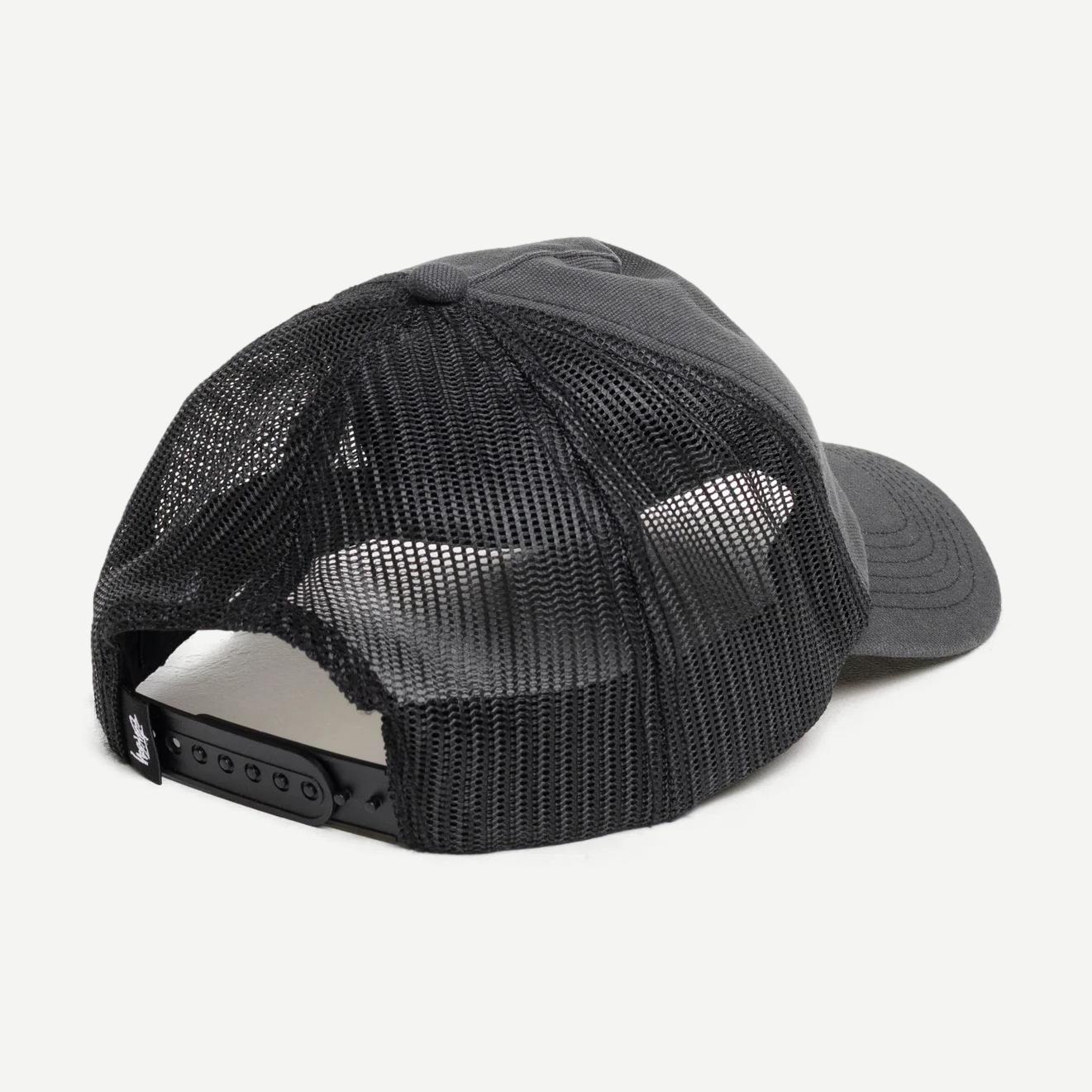 Black Stussy HP Ghost Logo Trucker Hat with embroidered front design and adjustable snapback closure.