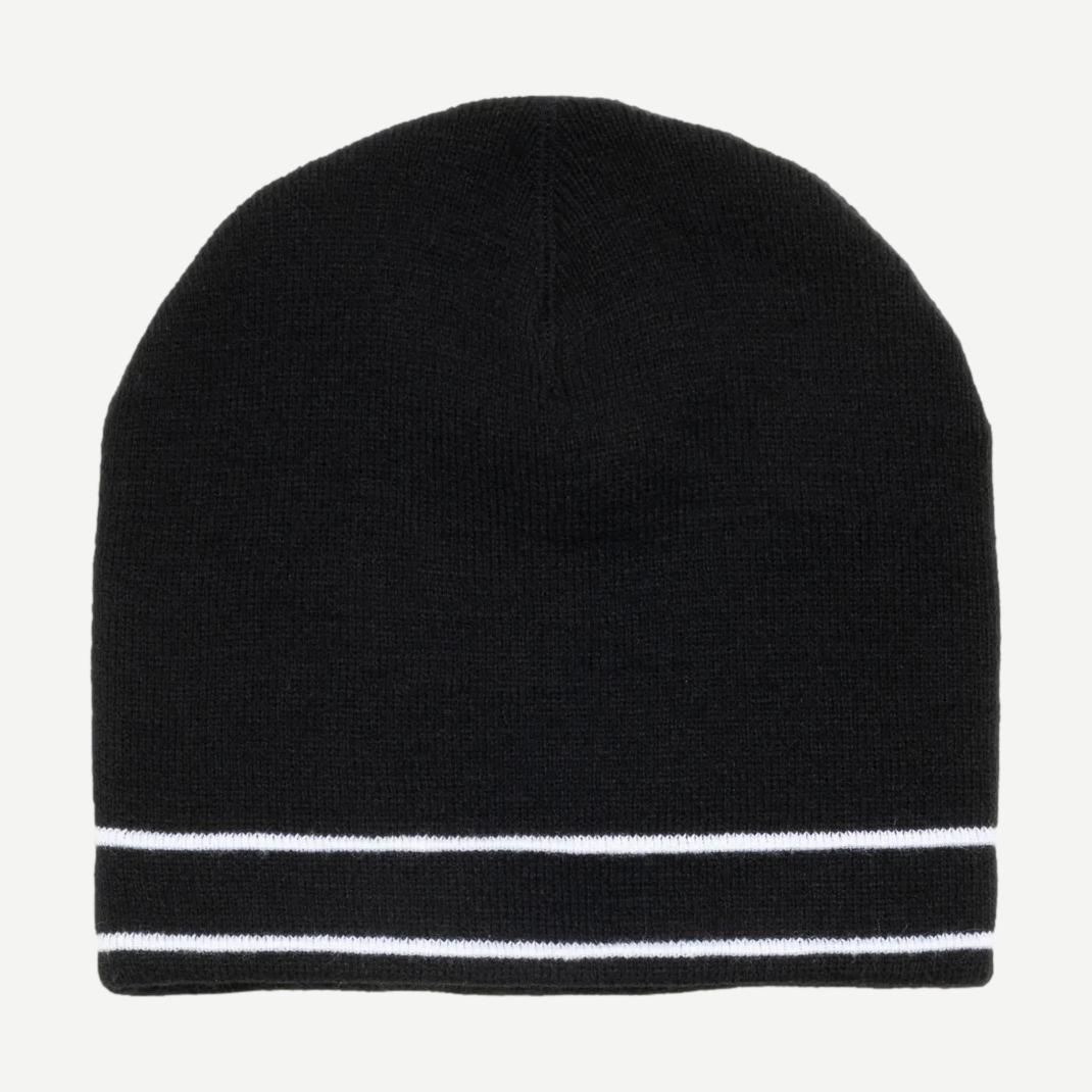 Black Stussy Clover Skullcap beanie shown on a model, featuring a snug fit and Stussy logo detail.