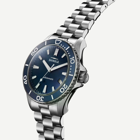 Shinola Monster Automatic Lake Michigan 39mm watch gift set featuring blue dial, mother-of-pearl accents, and silver case.