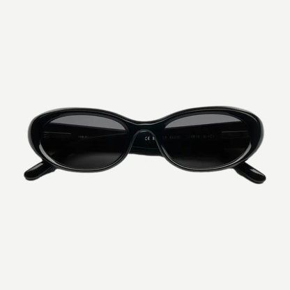 Chimi 09 black eyewear with sleek design, featuring rounded frames and clear lenses, shown from a front view.