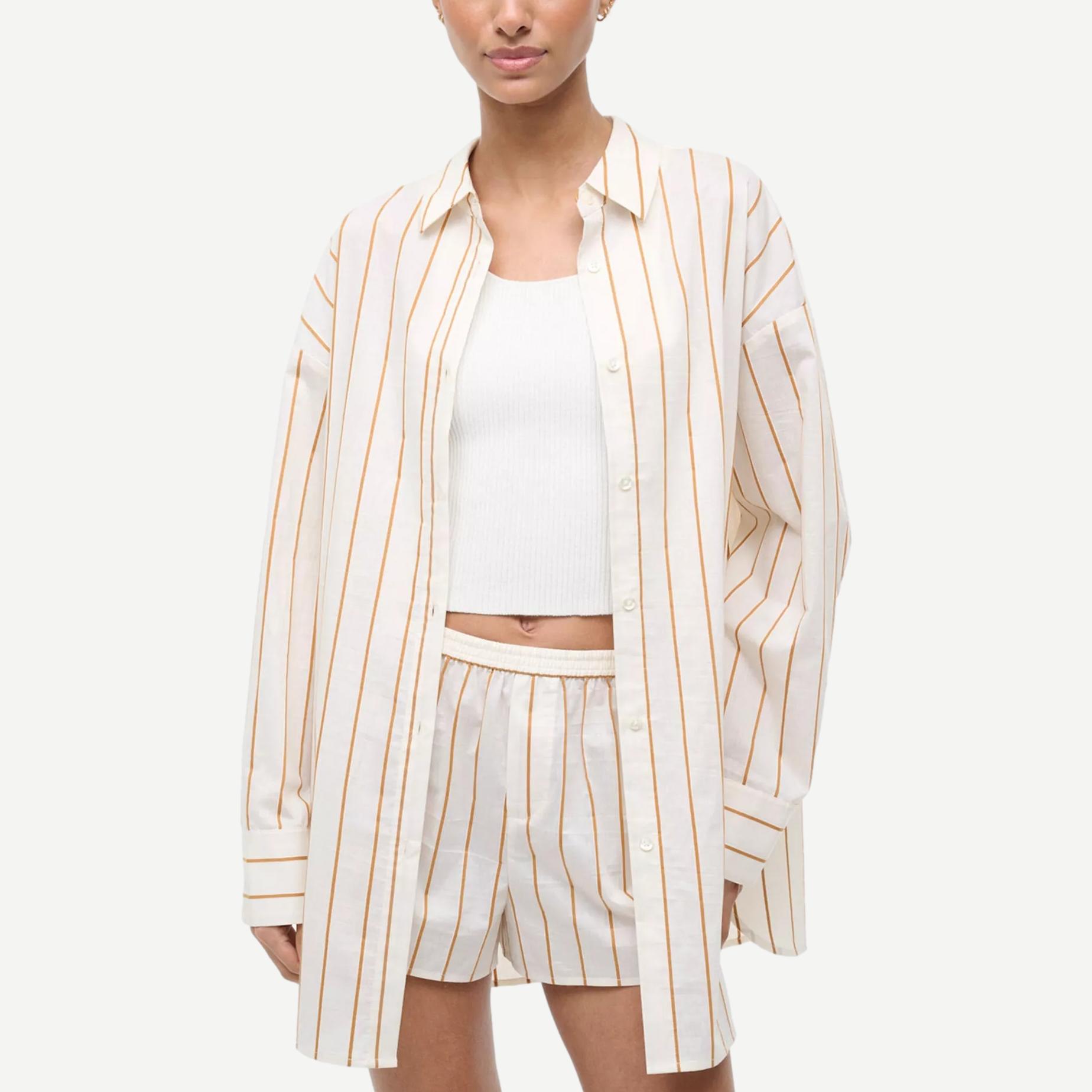Staud Kendy Top in Solana Stripe, a stylish shirt with vibrant striped pattern and tailored fit, shown on a model.