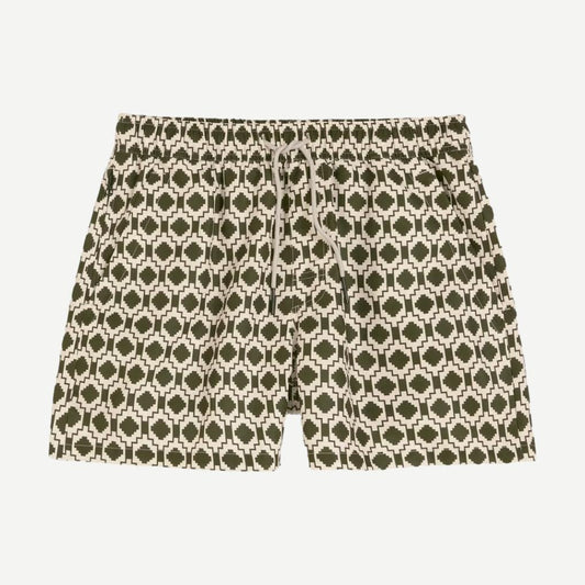 Dark green Pine Mitu swim shorts by OAS, made for swimming and beachwear, shown on a model.