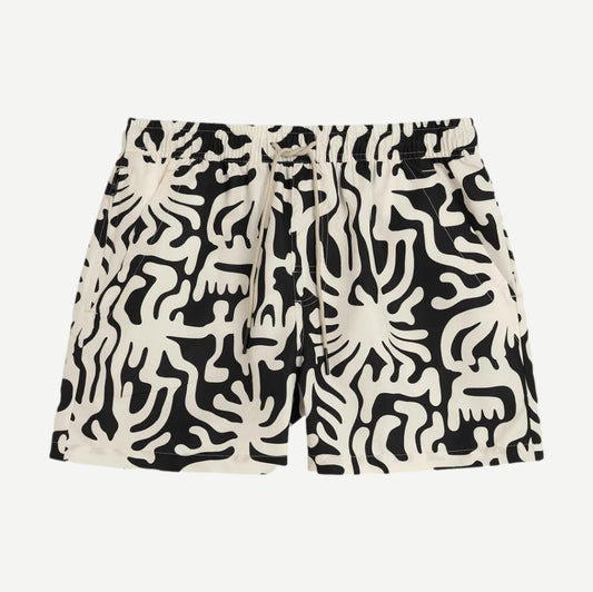 Black Loefy Swim Shorts by OAS, shown unfolded with elastic waistband and quick-dry fabric, ideal for beach or pool.