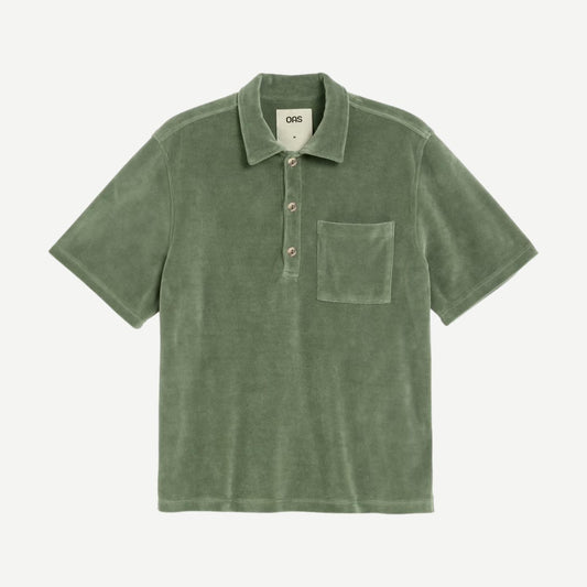 OAS Girona SS Button Up Shirt in green, a casual polo with collar and short sleeves, displayed on a hanger.