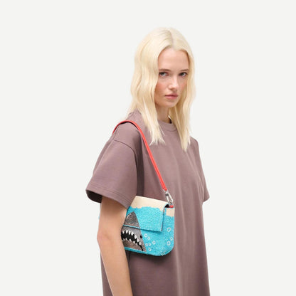 Staud Timmy Convertible Shoulder Bag in great white, showcasing its sleek purse design with adjustable strap and minimalist style.