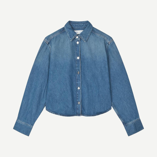 Fluid denim Sacelia shirt by Samsoe Samsoe, featuring a relaxed fit, long sleeves, and classic collar in a soft blue hue.