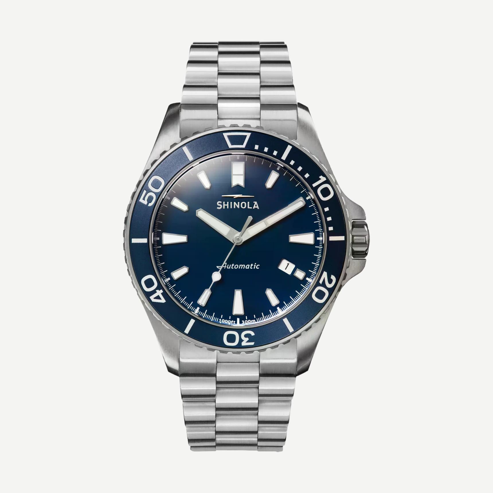 Shinola Monster Automatic Lake Michigan 39mm watch with blue dial, Mother of Pearl accents, and silver case in gift set.