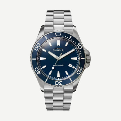 Shinola Monster Automatic Lake Michigan 39mm watch with blue dial, Mother of Pearl accents, and silver case in gift set.