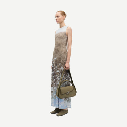 Samsoe Samsoe Saangel Dress in Hazy Fields with flowing fabric and floral pattern, displayed on a mannequin.