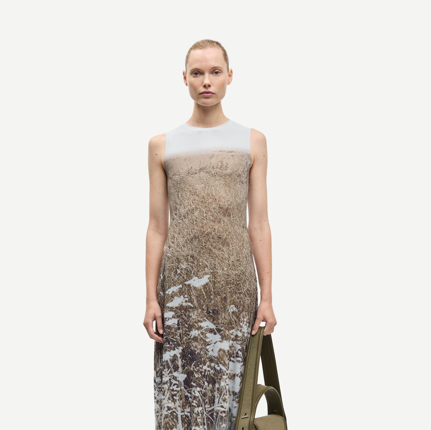 Samsoe Samsoe Saangel Dress in Hazy Fields with flowy fabric and floral pattern, displayed on a hanger against a neutral background.