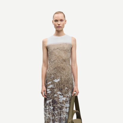 Samsoe Samsoe Saangel Dress in Hazy Fields with flowy fabric and floral pattern, displayed on a hanger against a neutral background.