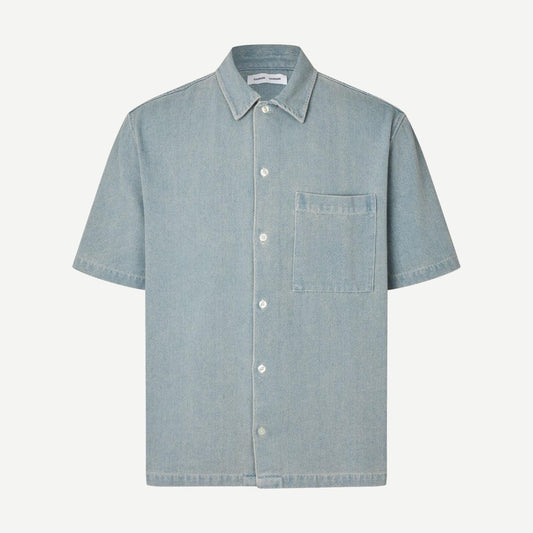 Samsoe Samsoe Saayo O Shirt in light denim, featuring a casual fit and classic button-up design, displayed on a hanger.