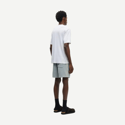 Light denim Sajabari shorts by Samsoe Samsoe, featuring a relaxed fit and classic denim texture, shown on a model.