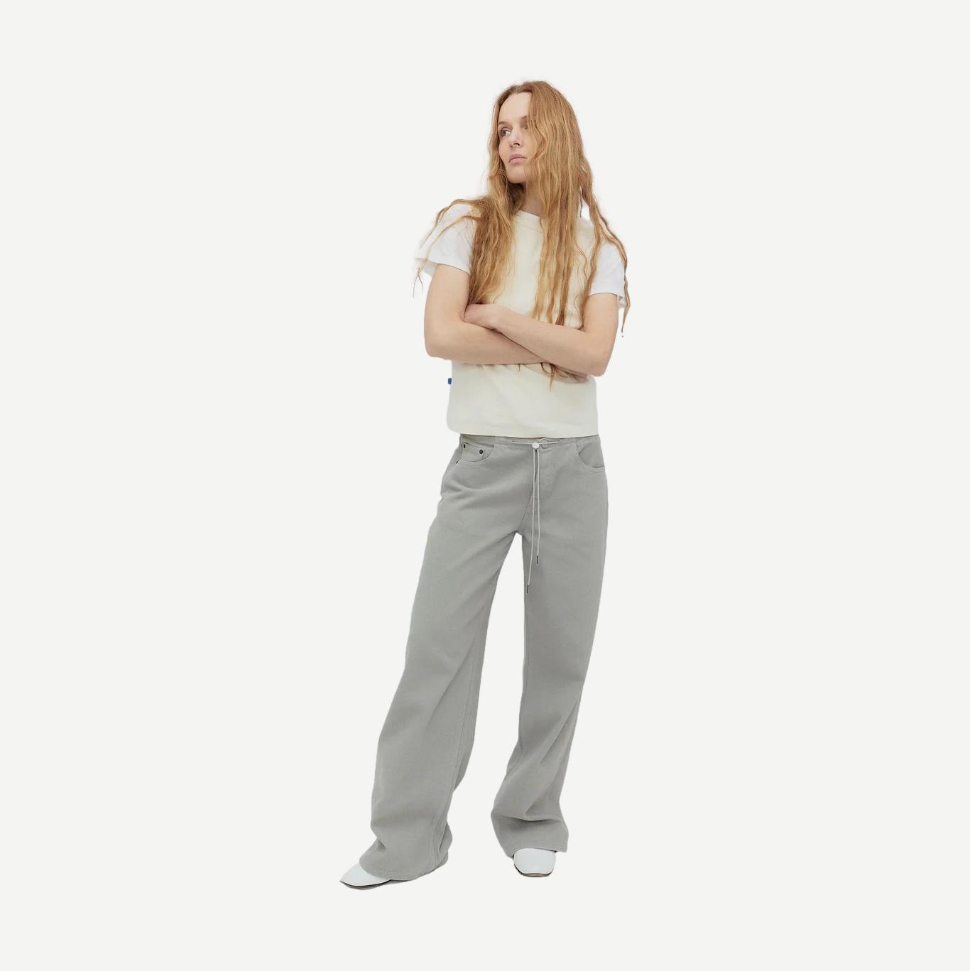 Still Here Cool Jean in Dust denim, showing a pair of stylish blue denim jeans with a relaxed fit and classic design.