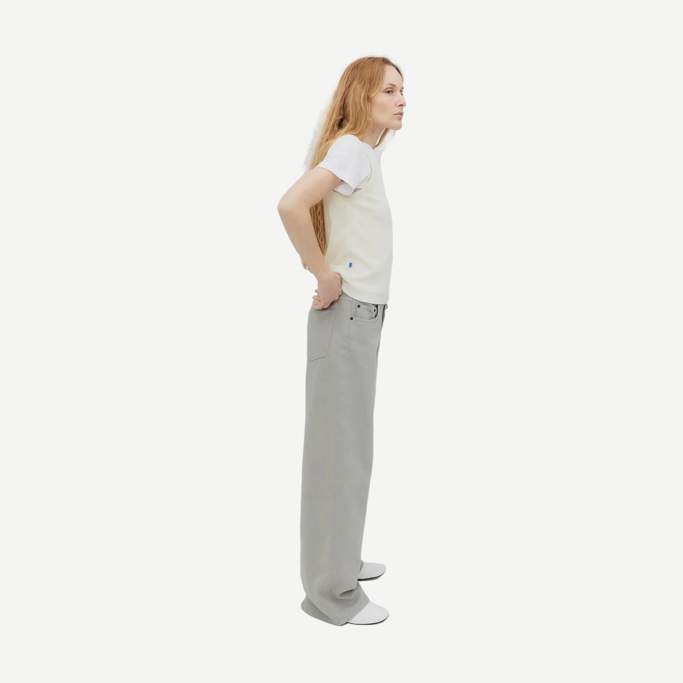 Still Here Cool Jean in Dust, stylish denim pants with a relaxed fit, shown on a hanger against a neutral background.