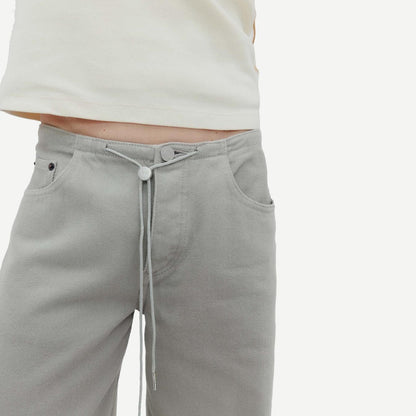 Still Here Cool Jean in Dust denim, showcasing relaxed fit and classic five-pocket style on a neutral background.