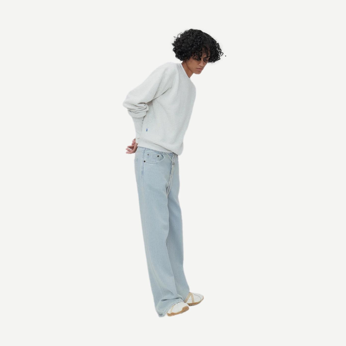 Still Here Cool Jean in vintage blue denim with classic fit and distressed details, showcasing a stylish casual look.