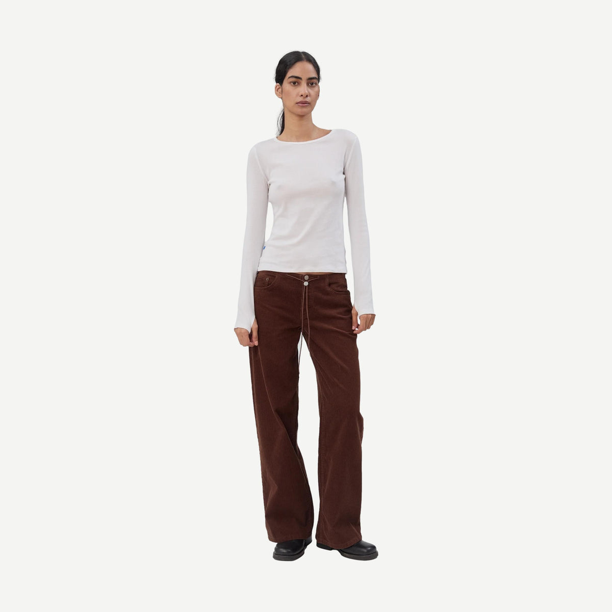 Still Here cool chocolate corduroy denim jeans for men, featuring classic fit and textured fabric.