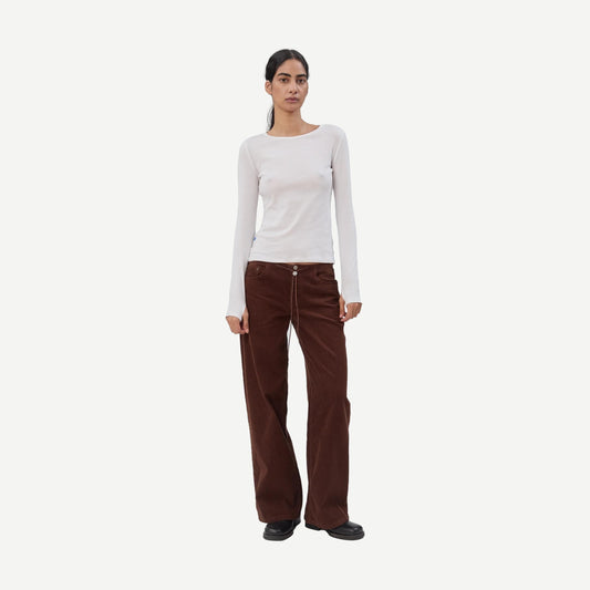 Still Here cool chocolate corduroy denim jeans for men, featuring classic fit and textured fabric.